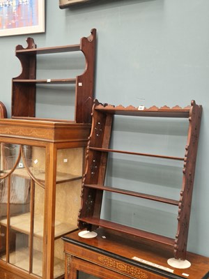 Lot 65 - Two mahogany wall shelves of three shelves...