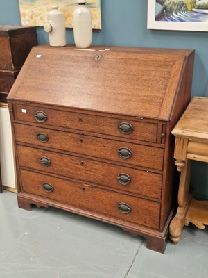 Lot 75 - A 19th century oak bureau, the fitted interior...