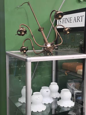 Lot 501 - A brass five light chandelier with milk glass...