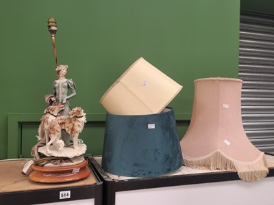 Lot 514 - A lady with two dogs table lamp together with...