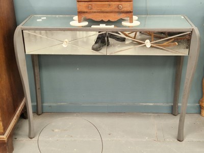 Lot 102 - A mirrored console table, the twin drawers on...