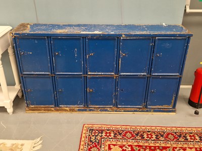 Lot 112 - A vintage painted steel bank of ten cupboards...