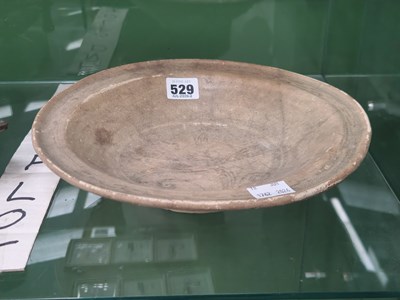Lot 529 - An antique Middle Eastern beige pottery...