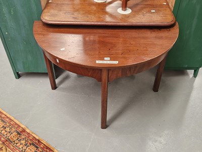 Lot 115 - A 19th century mahogany demilune table on...