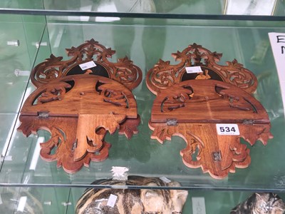 Lot 534 - A pair of Neopolitan olive wood wall brackets...