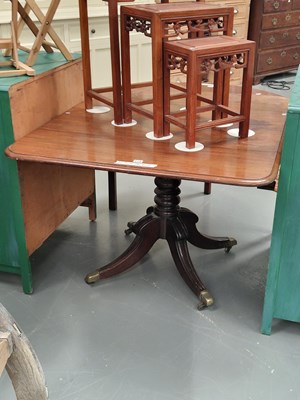 Lot 118 - A 19th century mahogany quatpod tea table on a...