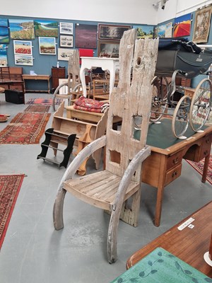 Lot 119 - A bleached hardwood high back elbow chair...
