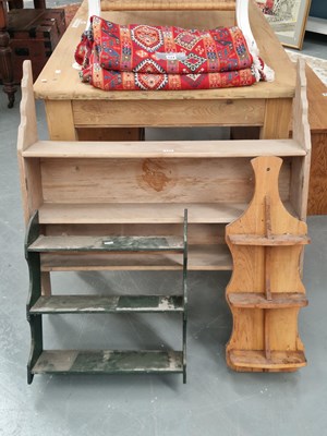 Lot 125 - An antique pine three tier wall shelf with...
