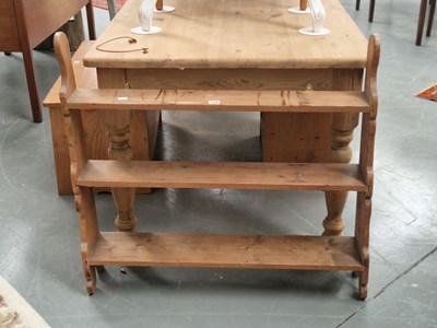 Lot 128 - A vintage pine three tier waterfall bookshelf...