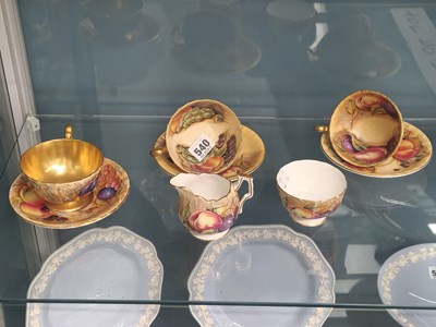 Lot 540 - Three Aynsley fruit decorated cups and saucers...