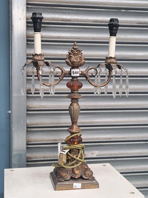Lot 544 - A gilt metal and amber glass two branch table...