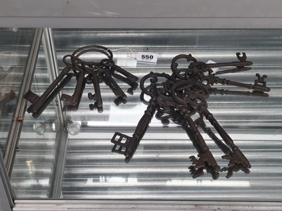 Lot 550 - Two rings of five vintage style iron keys
