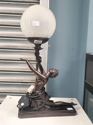 Lot 554 - A table lamp with the spherical glass shade...
