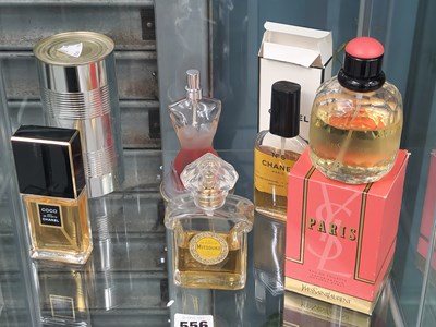 Lot 556 - Five glass scent bottles for Chanel, Guerlain,...