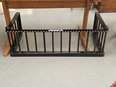 Lot 140 - A black painted wrought metal fire fender H 36...