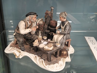 Lot 560 - A Capodimonte group of a couple taking a...