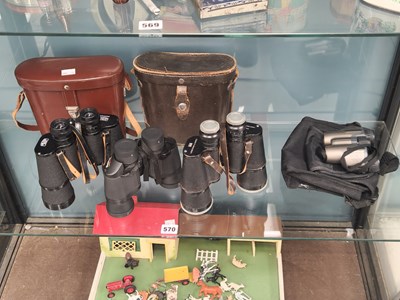 Lot 570 - Three cased pairs of binoculars, together with...