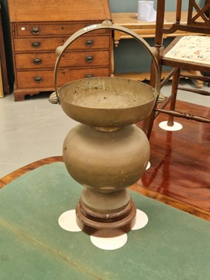 Lot 142 - An Indian brass kamandalu alms bowl with...