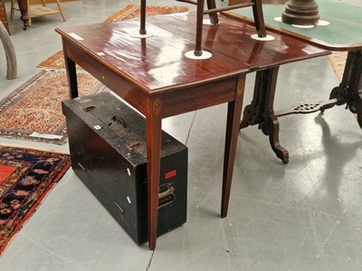 Lot 144 - A George III mahogany foldover tea table with...