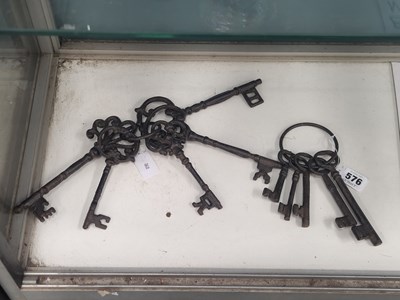 Lot 576 - Two rings of five vintage style iron keys