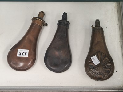 Lot 577 - Three copper powder flasks