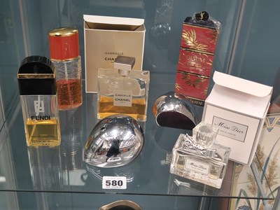 Lot 580 - Six scent bottles labelled for Chanel, Miss...