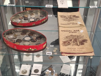 Lot 587 - Two albums of postage stamps together with a...