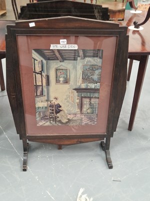 Lot 157 - An early 1900s fire screen set with a needwork...