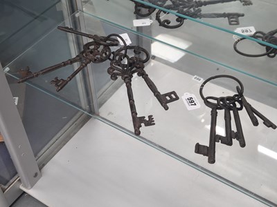 Lot 597 - Two rings of five vintage style iron keys
