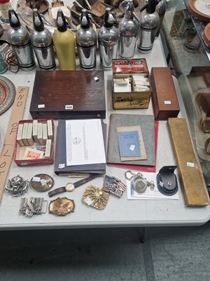 Lot 608 - Novelty belt buckles, cigarette cards, cased...