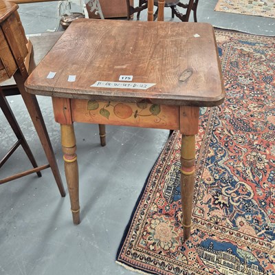 Lot 175 - A vintage pine side table, the decorated apron...