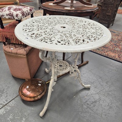 Lot 179 - A white painted allow garden table on three...