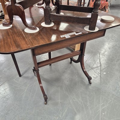 Lot 183 - A 20th century mahogany sofa table on two...