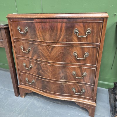 Lot 208 - A 20th century mahogany serpentine chest of...