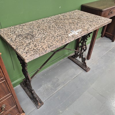 Lot 209 - A vintage cast iron table with a polished...