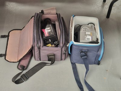 Lot 691 - A cased Panasonic RX11 VHS camera together...