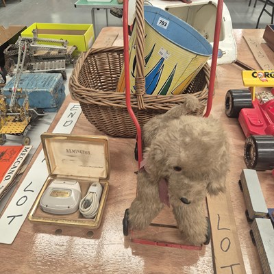 Lot 703 - A push along soft toy dog, a sailing boat...