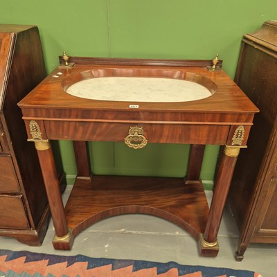Lot 251 - An antique French Empire mahogany ormolu...