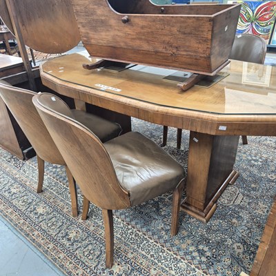Lot 256 - An Art Deco walnut dining table, the...