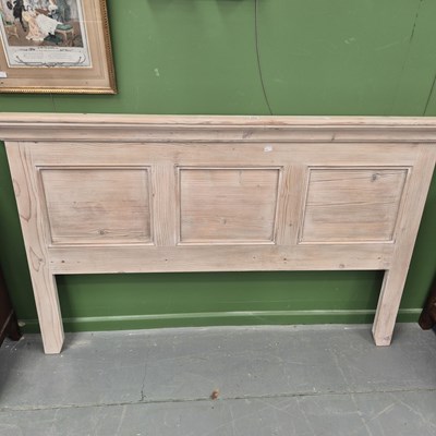 Lot 258 - A panelled pine headboard 102 × 161cm