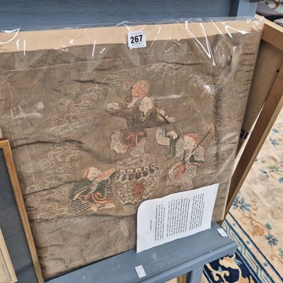 Lot 267 - An Oriental pale brown silk panel embroidered...