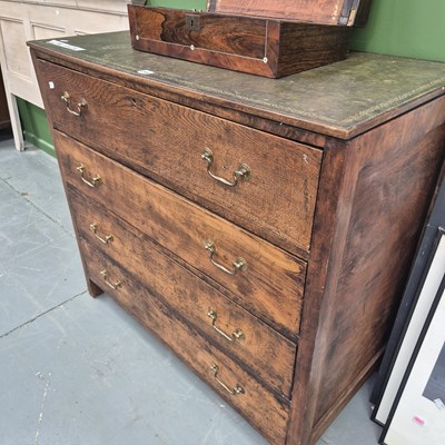 Lot 288 - A 20th century leather topped oak chest of...
