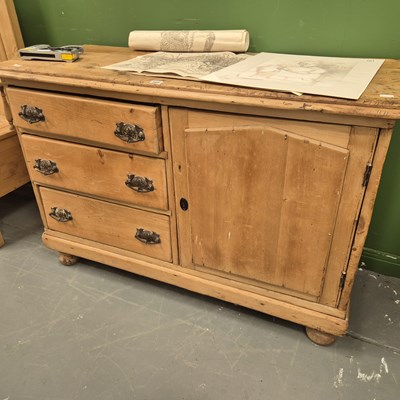 Lot 305 - An antique pine sideboard, the three drawers...