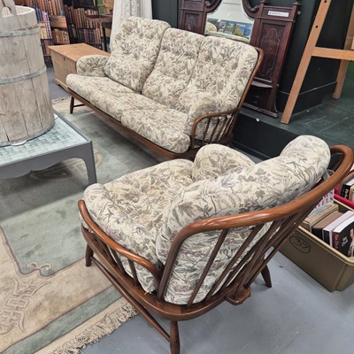 Lot 314 - A mid century modern Ercol three piece spindle...