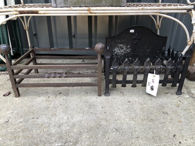 Lot 454 - A pair of metal fire grates of different designs