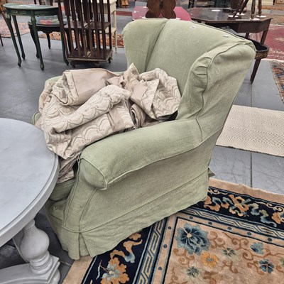 Lot 328 - An antique wing arm chair in pale green loose...