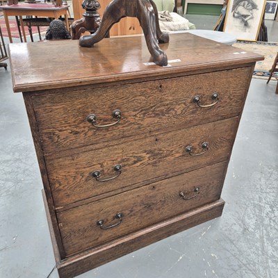 Lot 332 - An early 20th century oak chest of three...