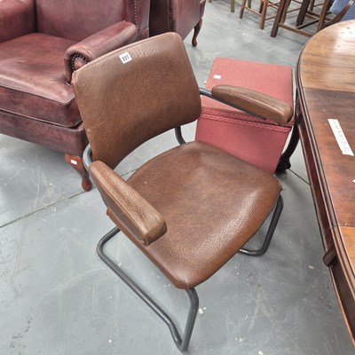 Lot 337 - A mid century tubular steel elbow chair in a...