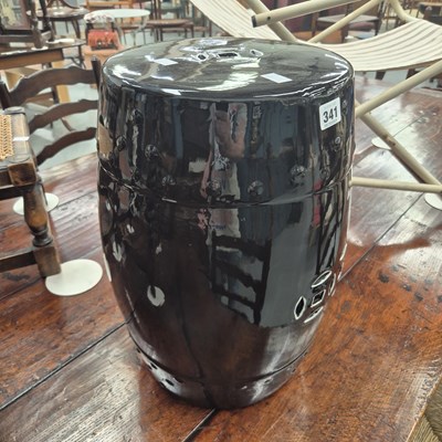 Lot 341 - A black glazed Oriental style ceramic stool H...