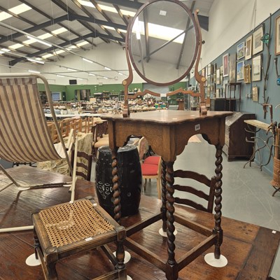 Lot 342 - An Edwardian oak occasional table on barley...